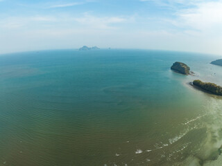Aerial view of beautiful sea in summer season sky background,Drone view Waves water surface texture on sunny tropical ocean in Phuket island Thailand