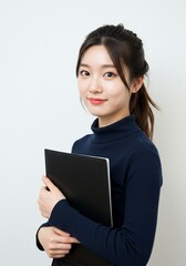 beautiful young woman standing upright confidently holding a black document folder with a smiling face on a white background