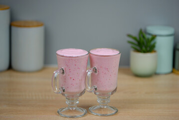 Protein berry shake in the kitchen, concept of diet and healthy eating