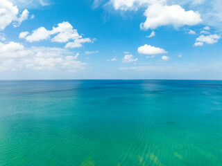 Aerial view of beautiful sea in summer season sky background,Drone view Waves water surface texture on sunny tropical ocean in Phuket island Thailand