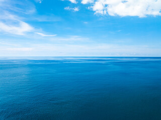 Aerial view of beautiful sea in summer season sky background,Drone view Waves water surface texture on sunny tropical ocean in Phuket island Thailand
