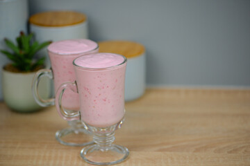 Protein berry shake in the kitchen, concept of diet and healthy eating