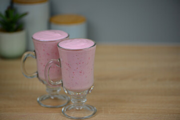 two glasses pink berry smoothie, healthy diet food