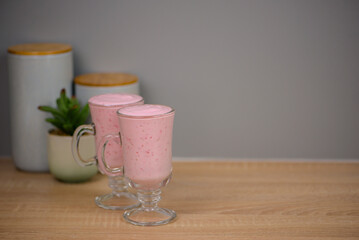 Protein berry shake in the kitchen, concept of diet and healthy eating