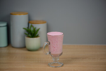 Protein berry shake in the kitchen, concept of diet and healthy eating
