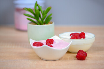 Raspberry dessert on the table in the kitchen, healthy breakfast