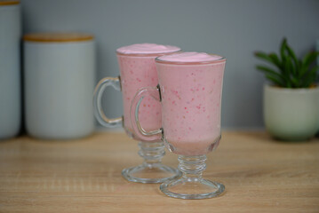 Protein berry shake in the kitchen, concept of diet and healthy eating