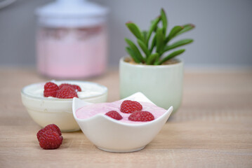 Raspberry dessert on the table in the kitchen, healthy breakfast