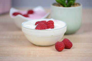 Raspberry dessert on the table in the kitchen, healthy breakfast