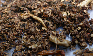  This close-up photograph showcases dried chili seeds that are fully prepared for planting