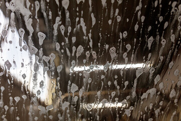 A car with a lot of spray paint on it