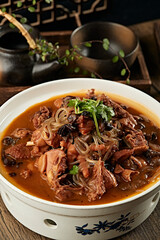 Traditional Northeastern home-cooked dish: Chicken stewed with mushrooms (chicken stewed with hazel mushrooms)