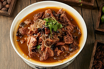 Traditional Northeastern home-cooked dish: Chicken stewed with mushrooms (chicken stewed with hazel...