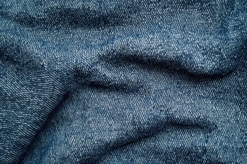 Close-up textured blue denim fabric background.