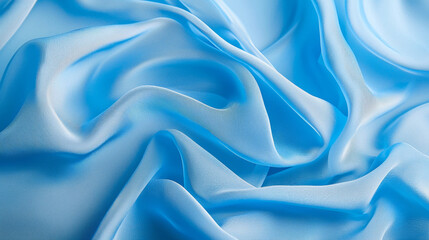 Obraz premium Soft blue fabric with gentle folds and light reflections creates serene atmosphere