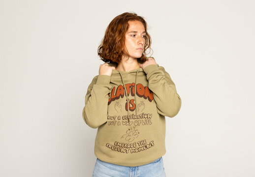 Redhead in Hoodie Featuring a PSD Mockup Template. Note: jumper&acute;s color cannot be changed.