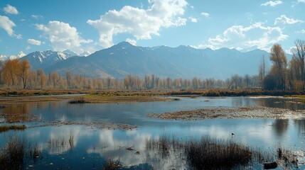 Fototapeta premium A scenic view of Pahalgam, Kashmir--meadows alive with color, a flowing river glistening under the sun, with the Himalayas standing tall.