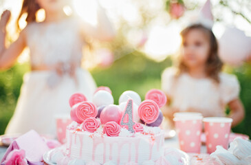 Party decoration 4 birthday cake. pink and violet colors sugar chocolate sphere. Festive table setting for birthday on celebratory decorations
