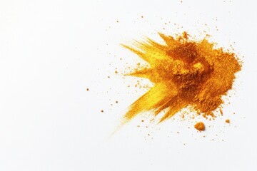 Golden turmeric powder spread on white background