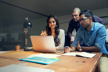 Night, laptop and meeting with business people in office for teamwork, planning and media agency. Collaboration, creative advice and production editor with employees for discussion and intern