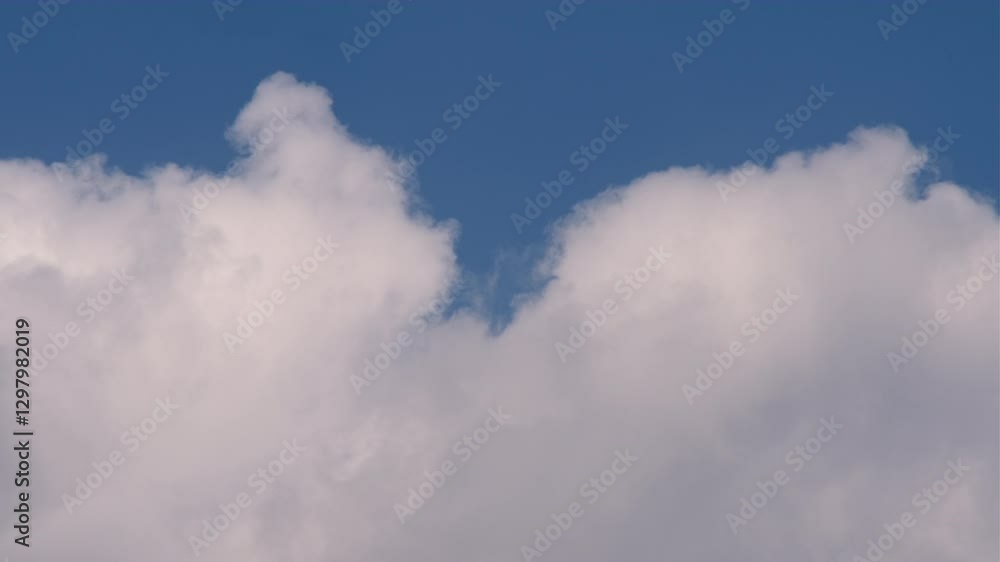 Aufkleber time lapse of a serene blue sky with fluffy white clouds evoking feelings of peace and freedom the c
