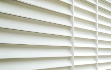 White horizontal blinds create a clean and modern interior atmosphere in a bright room