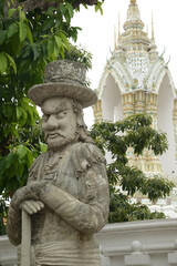 Obraz premium Chinese guardian statue at the gate of Wat Pho Which is one of the largest and oldest temples in Bangkok and is popular with both Thai and foreign tourists.