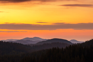 Obraz premium Majestic Sunrise over a Mountain Range. A breathtaking vista of a mountain range at sunrise. Pamporovo Bulgaria 