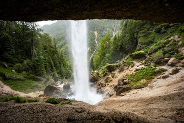 Pericnik waterfall is a beautiful drop from the mountain cliff, in Triglav National Park. Slovenian waterfall. Long for walking and trekking, enter inside the cave to admire it. Powerful and majesty.