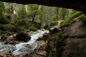 Pericnik waterfall is a beautiful drop from the mountain cliff, in Triglav National Park. Slovenian waterfall. Long for walking and trekking, enter inside the cave to admire it. Powerful and majesty.