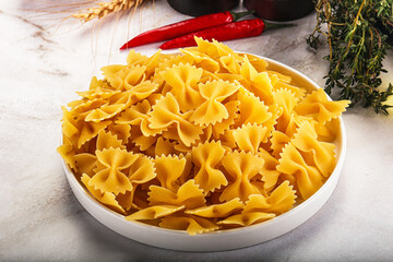 Raw dry Italian pasta - farfalle