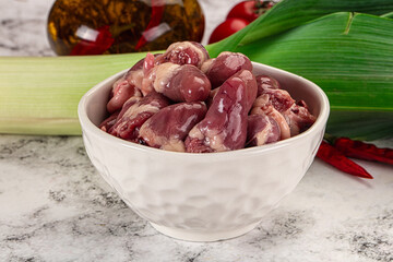 Raw chicken hearts in the bowl