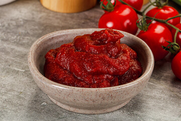 Red tomato paste in the bowl