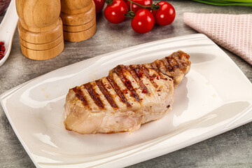 Grilled pork loin steak with bone
