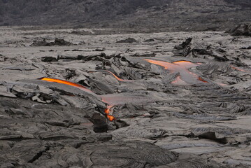 Active lava flows over old lava field in Hawaii