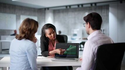 Financial Consultant Talking With Client Couple About Stock Portfolio - Powered by Adobe