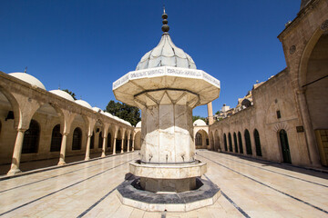 SANLIURFA TURKEY A serene ablution fountain in a historical mosque courtyard.This image showcases a...