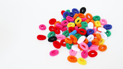 Multi-colored hair ties on white background