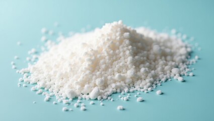 Magnesium Citrate. White powder is scattered on blue surface