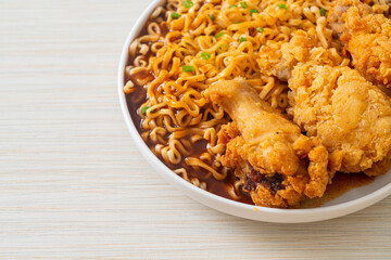 Korean instant noodles with fried chicken or Fried chicken ramyeon
