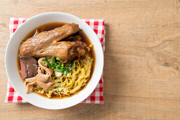 egg noodles with stewed and braised duck in brown soup