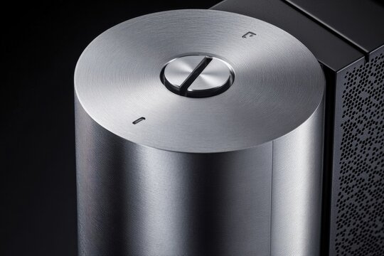 Sleek Silver Control Knob on Modern Electronic Device Against Black Background