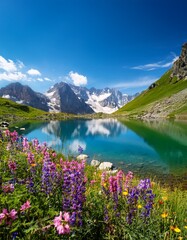 Mountain lake & wildflowers reflect bright blue summer sky.  Vibrant & serene nature scene. Ideal for summer, nature, and scenic backgrounds.

