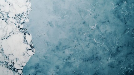 Obraz premium A close-up view of a textured surface featuring light blue hues and marbled patterns blending with white and darker shades.