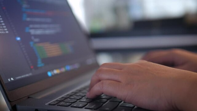 Hands of people using laptop computer to do coding work, programming, work from home, freelance