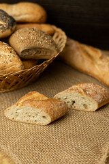 Pieces of sliced ciabata are lying on the table. Cooking. Breakfast. Breads