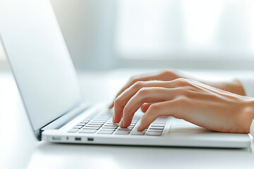Close up photo of woman hands typing on laptop, showcasing focus and productivity in bright workspace