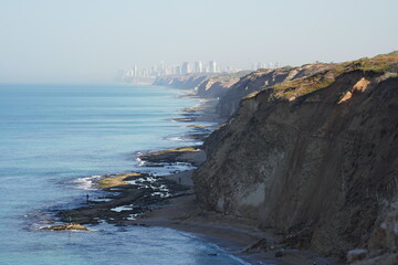 Mediterranean sea in spring. Deserted shorekurkar sandstone cliff nature reserve, high above the Mediterranean sea coastline between Herzliya and Netanya towns, Israel.
