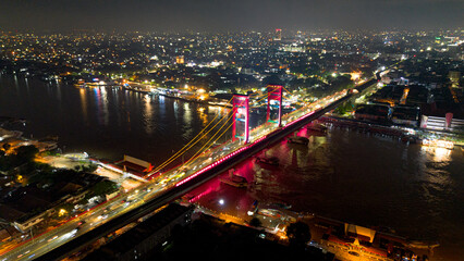 Aerial shot of Ampera Bridge at night, one of the landmarks of Palembang city, South Sumatra,...