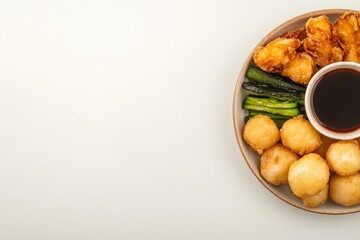 Delicious assortment of fried foods and vegetables served with d